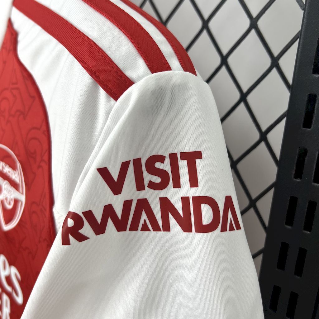 White sleeve with red stripes and large red 'VISIT RWANDA' text