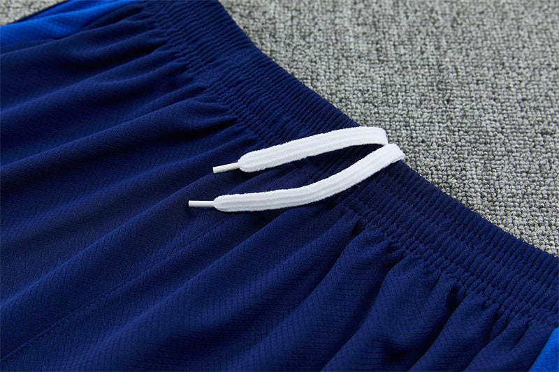 Navy training shorts with white drawstring and gathered elastic hem