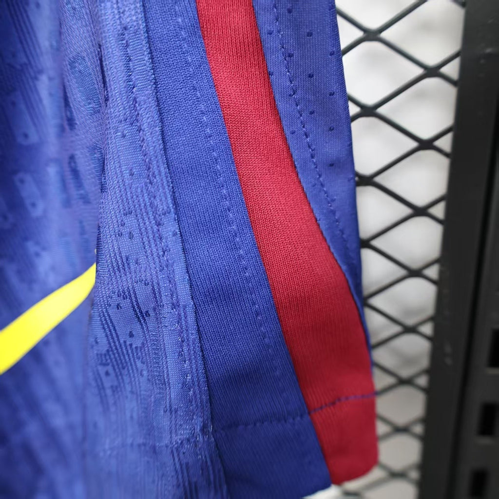 Blue player shorts side view with red stripe trim
