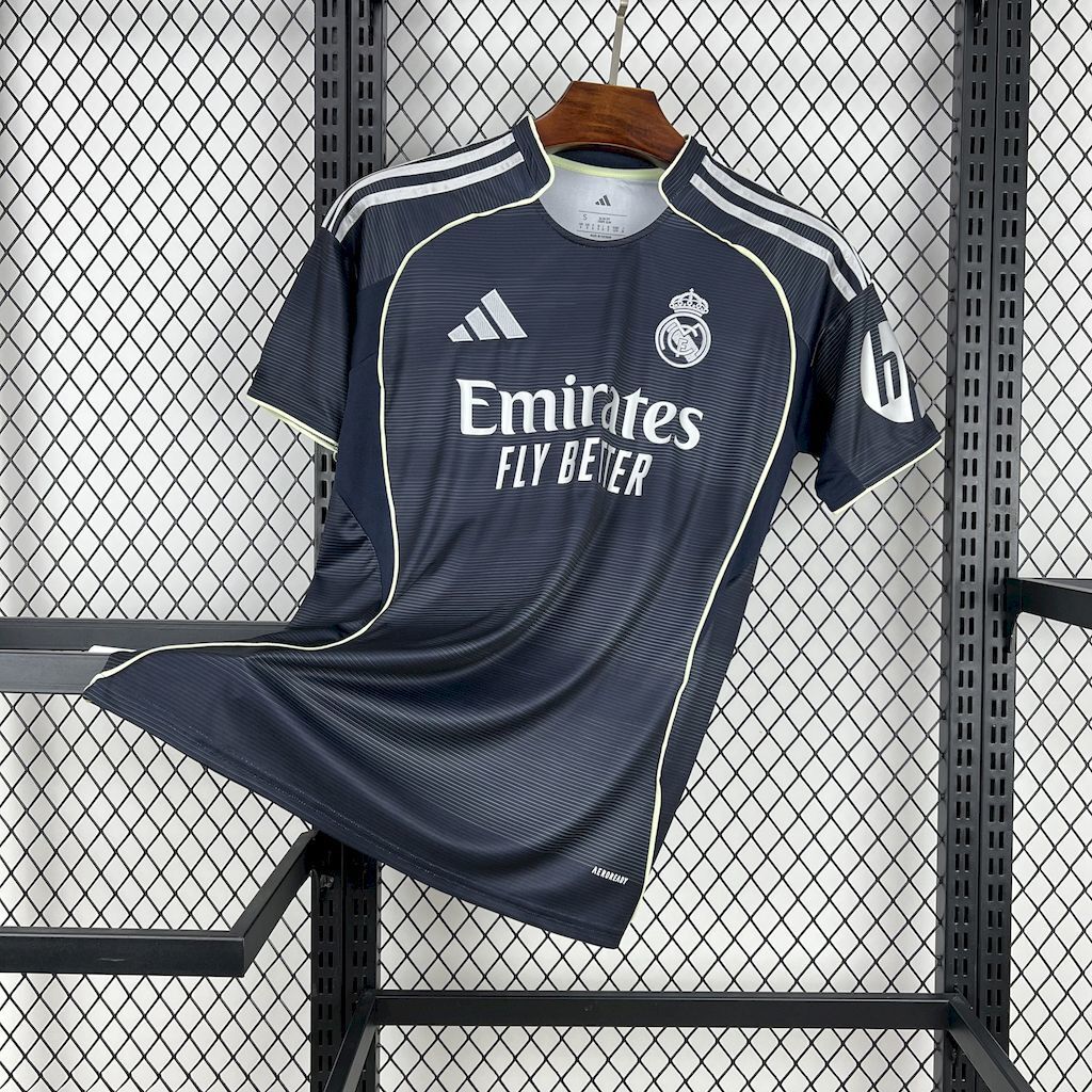 Dark navy Real Madrid away fan jersey with white Adidas stripes and Emirates Fly Better print