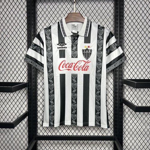 Retro soccer jersey, white with black vertical stripes, Coca-Cola and Umbro logos
