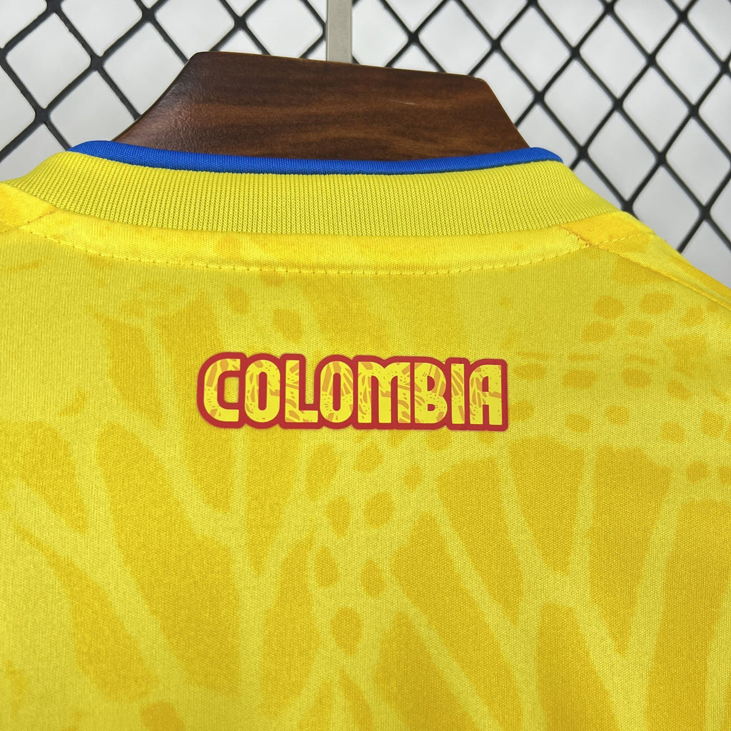 Yellow jersey back with large 'COLOMBIA' name graphic in red-and-yellow letters.