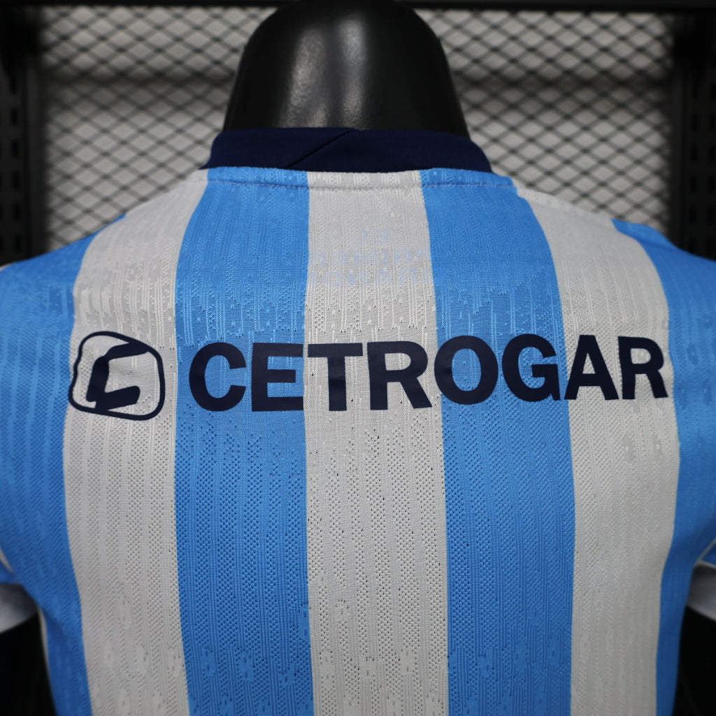 Blue-and-white striped soccer jersey back with large 'CETROGAR' sponsor print