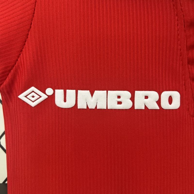 Red kids soccer jersey with Umbro logo across the chest in white