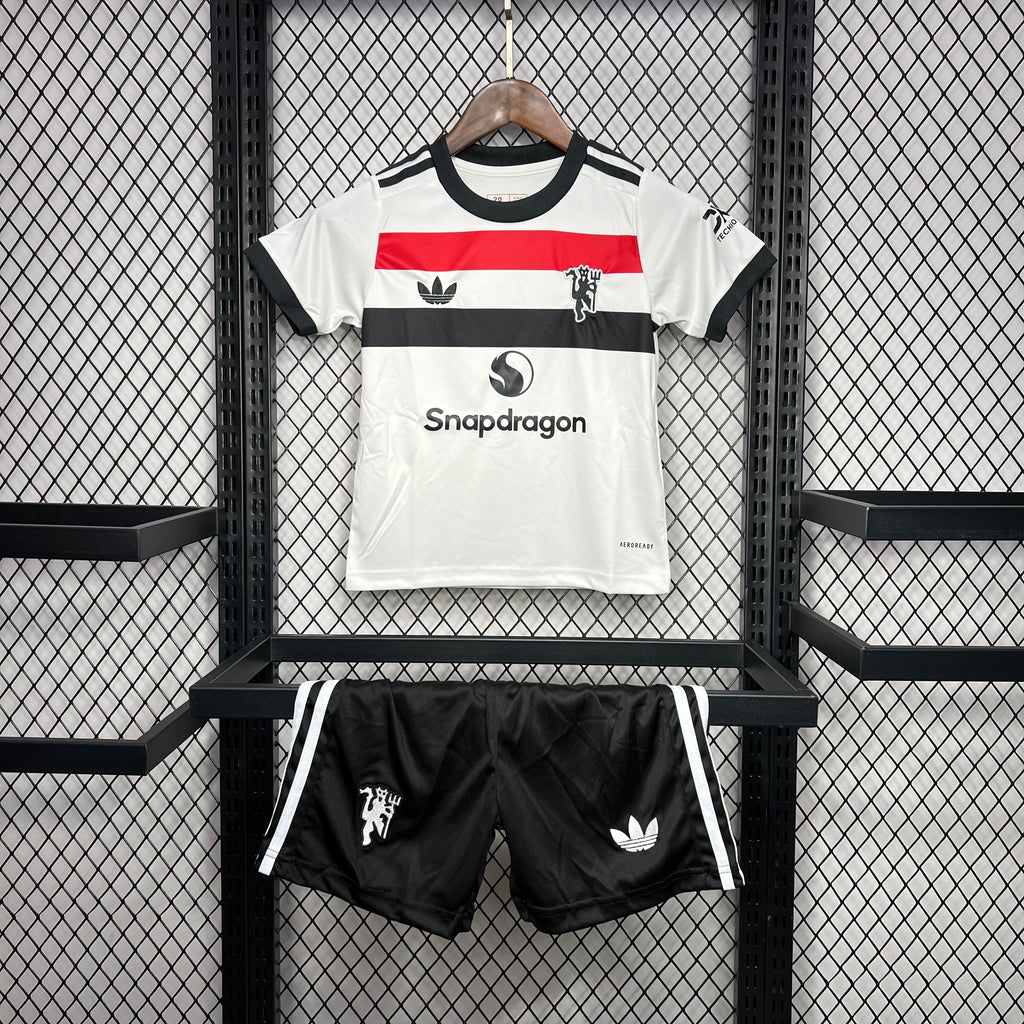 Kids football kit: white jersey with black/red stripes and matching black shorts