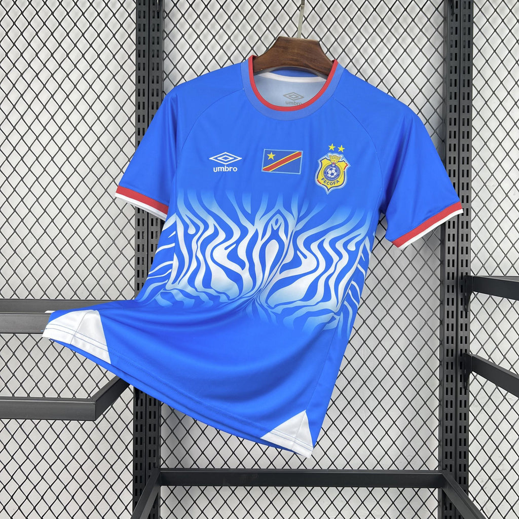 Blue Congo home soccer jersey with red collar trim and wave flame graphic, Umbro logo