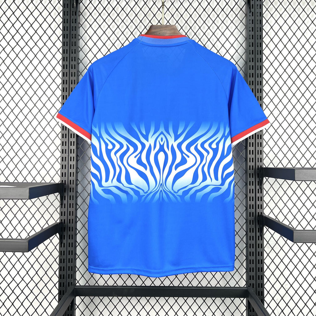 Blue Congo home soccer jersey back view with red trim and wave flame graphic