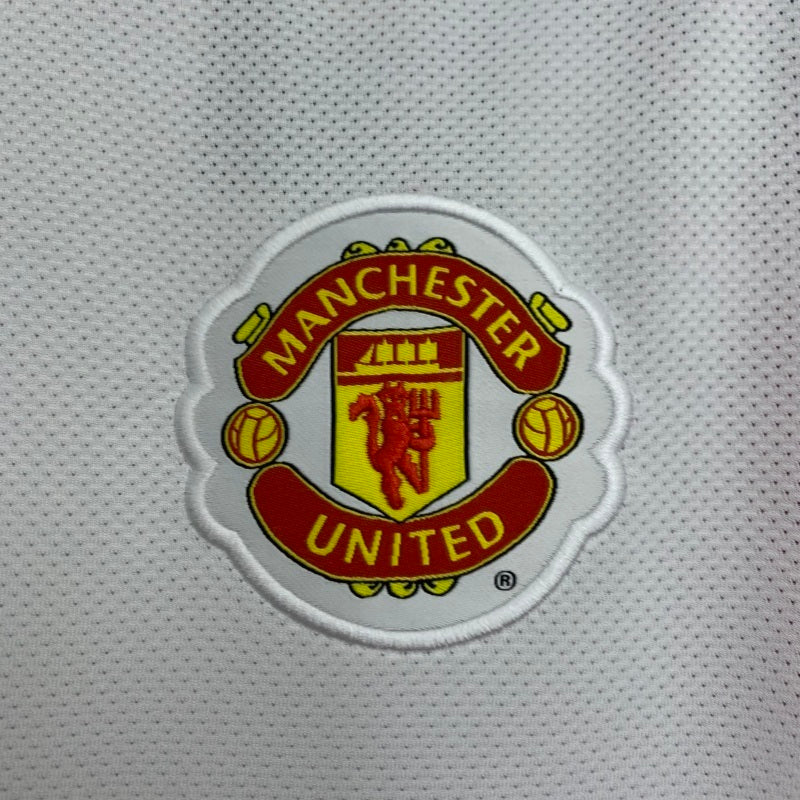 Manchester United crest patch on white away football jersey