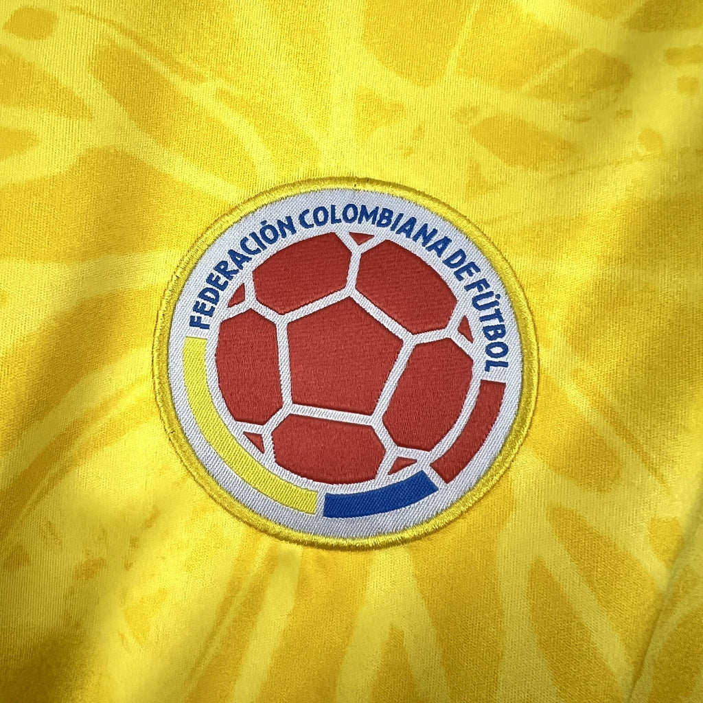 Yellow jersey featuring the circular Colombia federation crest patch on the chest.