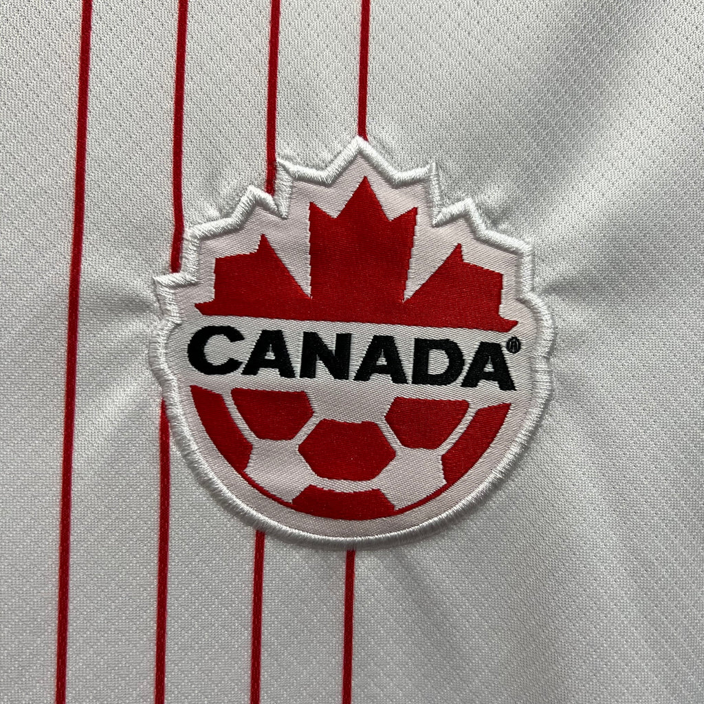 Canada crest patch on white jersey with red soccer ball and shield embroidery
