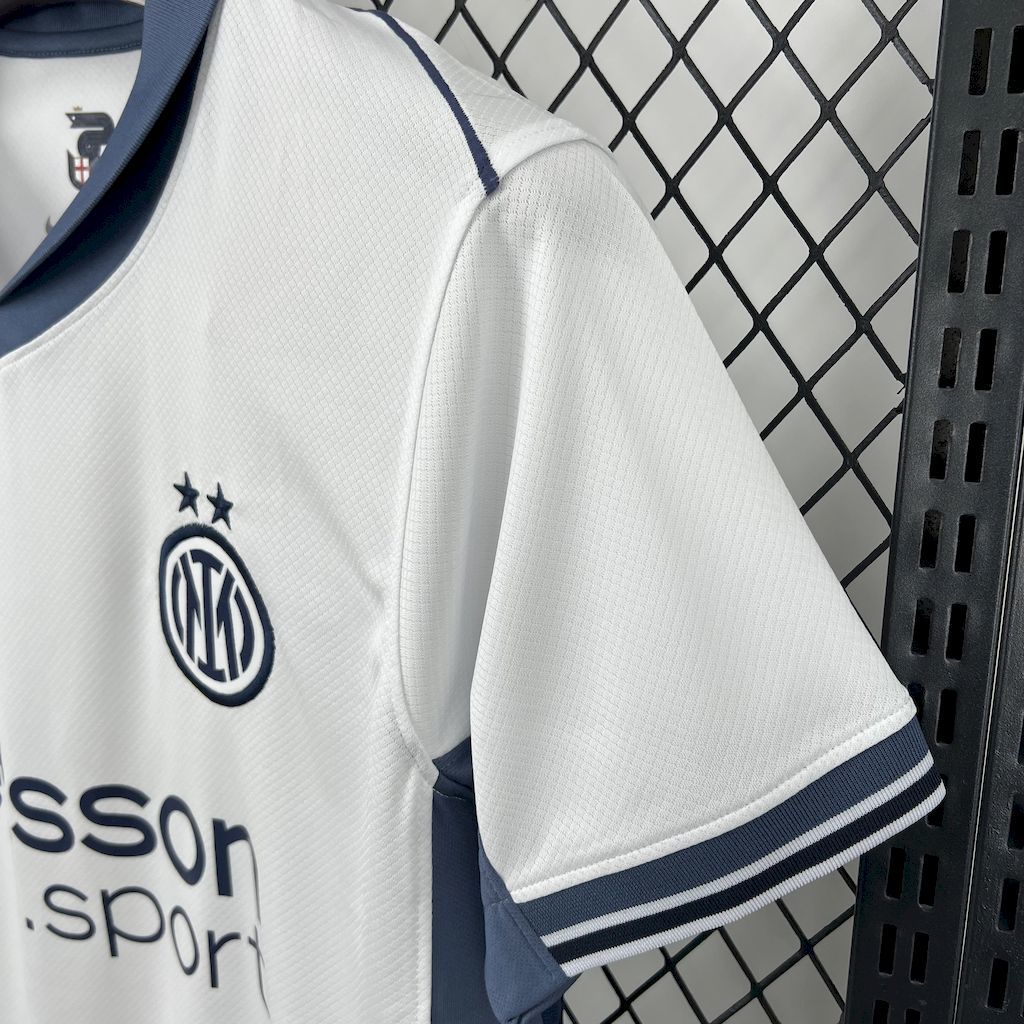 White Inter Milan away fan jersey sleeve with crest and blue collar trim