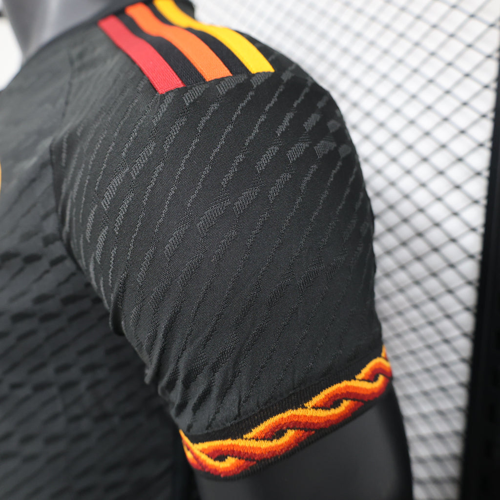 Roma third football jersey, side view with textured pattern and red-orange armband trim