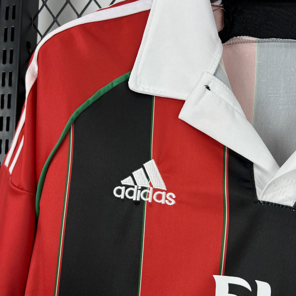 Soccer jersey front with white adidas logo and AC Milan crest on red and black