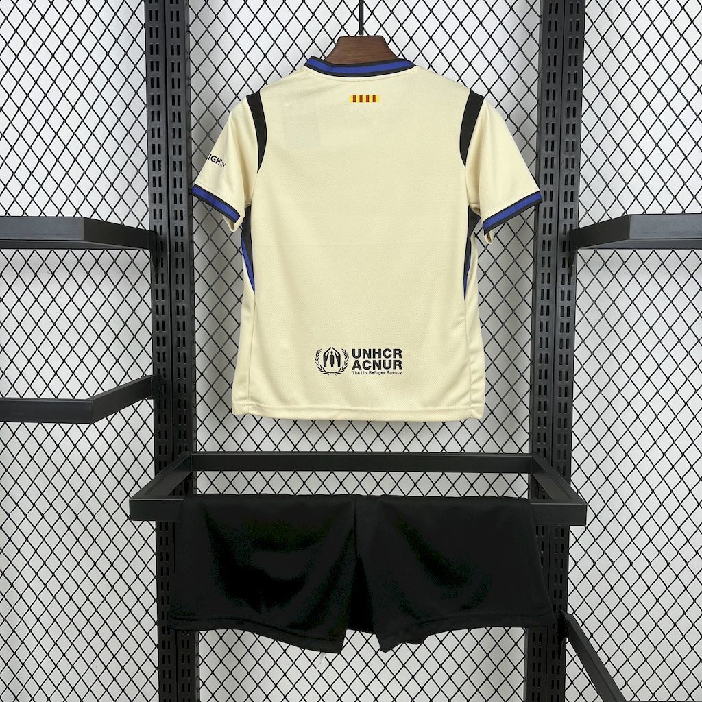 Kid away jersey back view in cream with blue trim and UNHCR sponsor patch