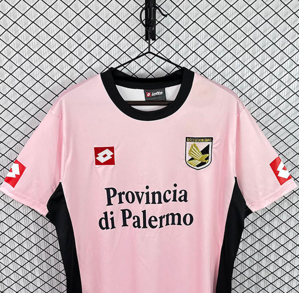Pink Palermo home jersey with black collar, Provincia di Palermo print, and crest badges