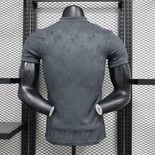 Dark gray football jersey on mannequin, back view with green-trim sleeve edges