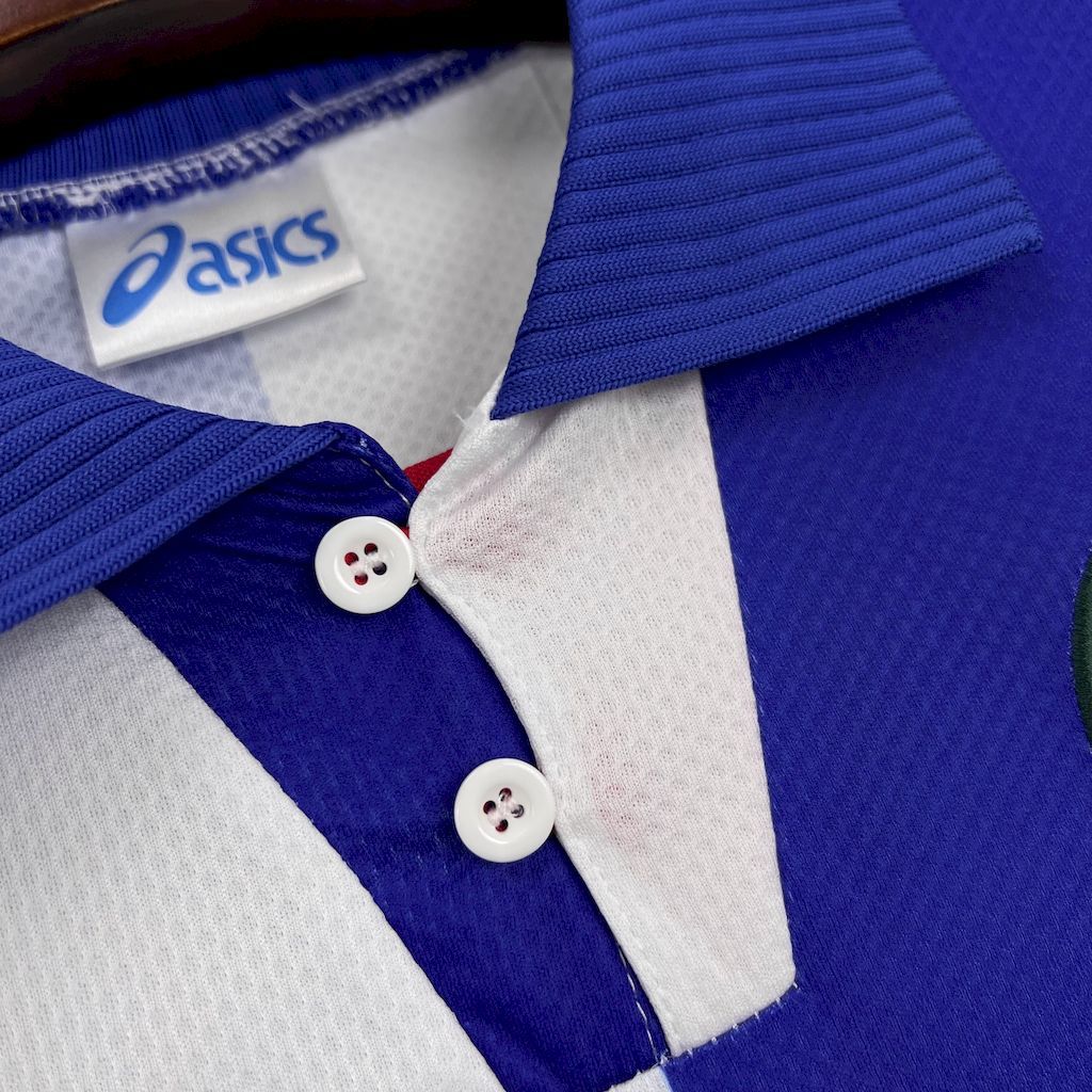 Close-up of retro football shirt collar and button placket in blue and white