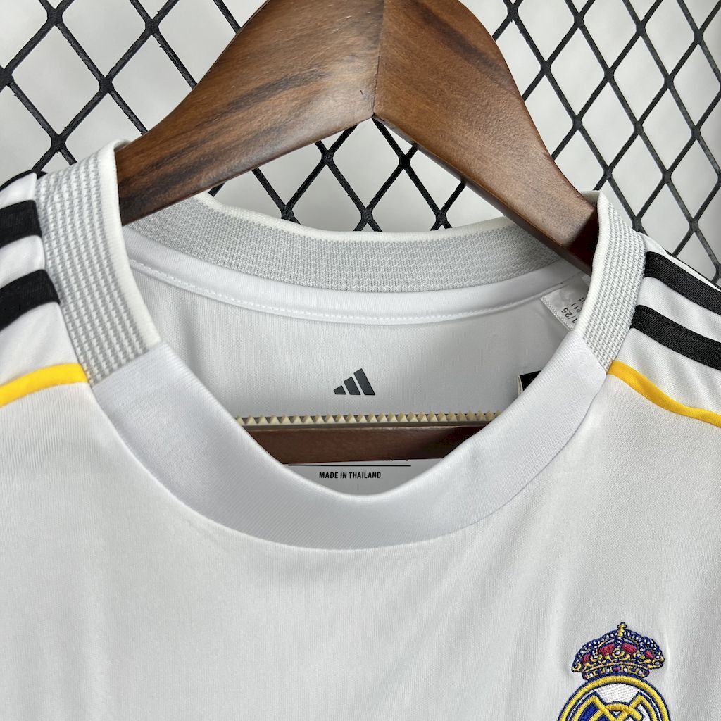 Women’s white football jersey neckline with Adidas mark and Real Madrid crest