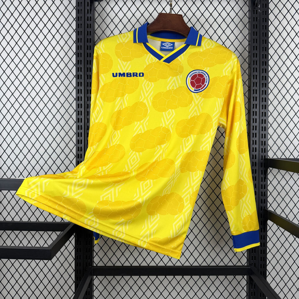 Retro Colombia home soccer jersey, yellow with blue trim and Umbro logo, long sleeves.