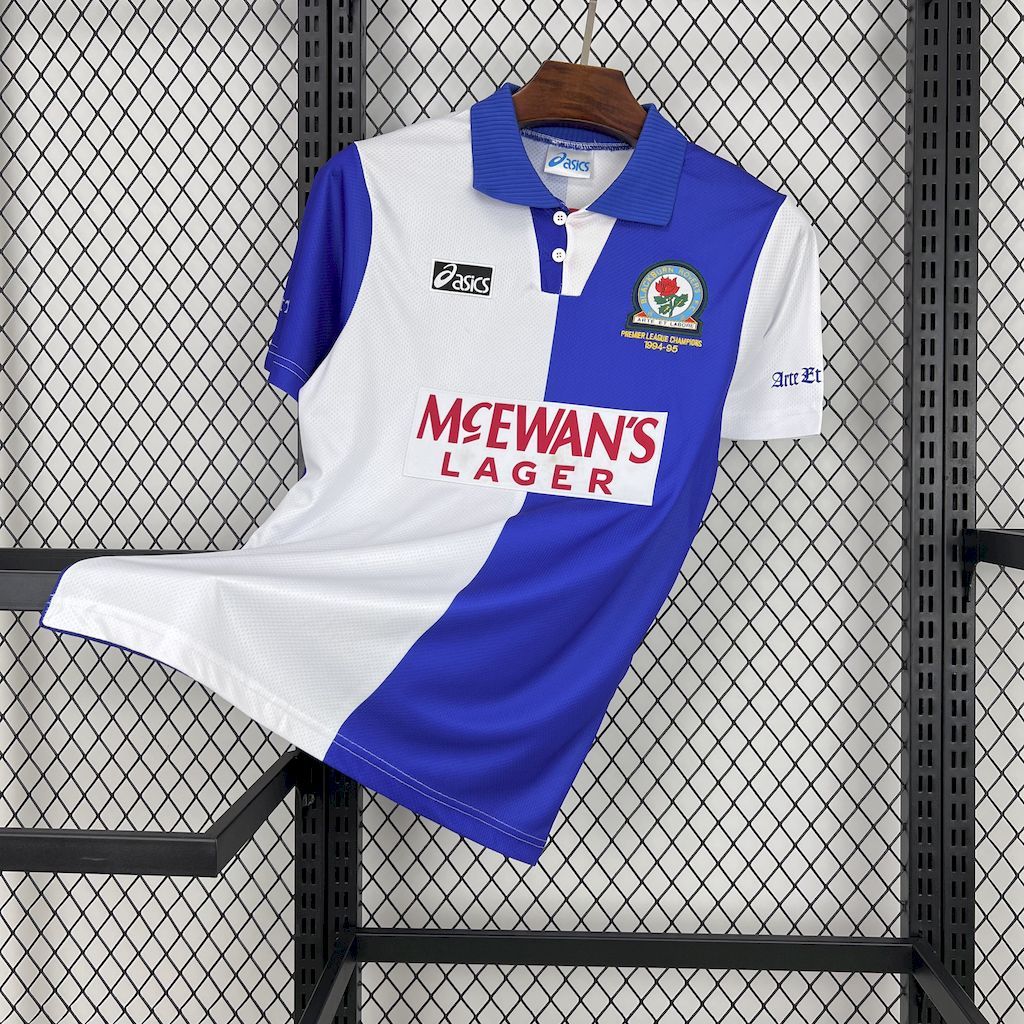 Retro home football shirt with white front, blue sleeves, button collar, and McEwan’s Lager logo