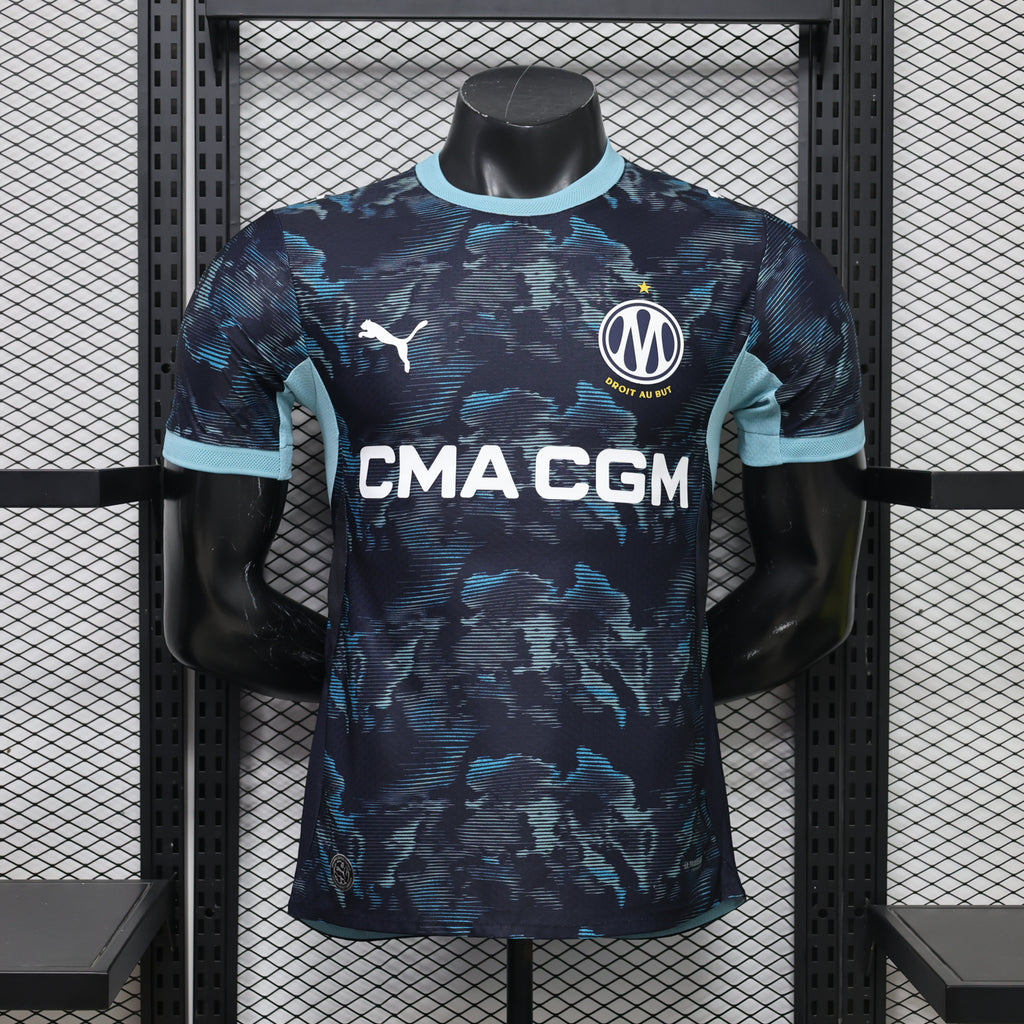 Navy away football jersey with light-blue trim and CMA CGM sponsor on front