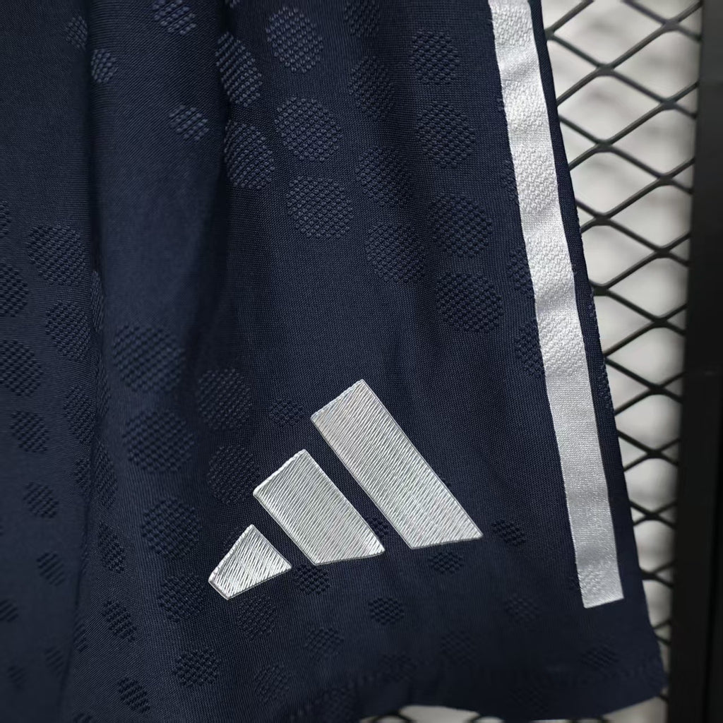 Navy player shorts with white adidas three stripes and textured dot pattern