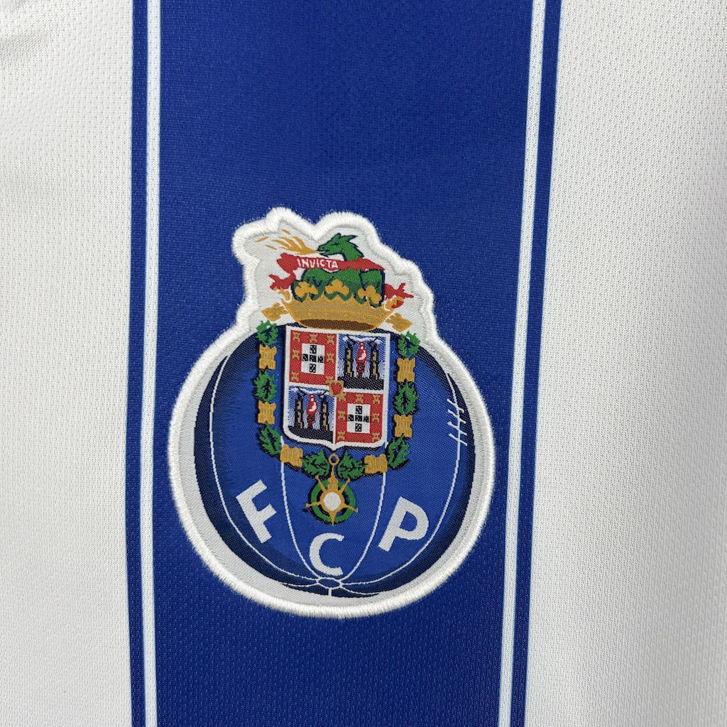 Retro Porto jersey crest close-up on blue-and-white striped fabric