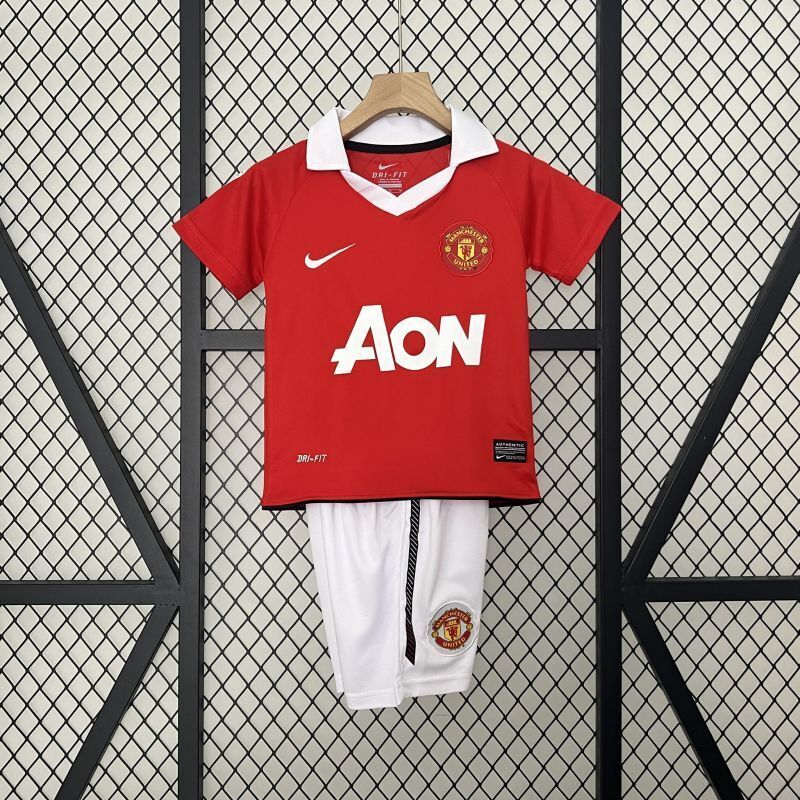 Red Manchester United home kid football jersey and white shorts, AON sponsor and Nike logo