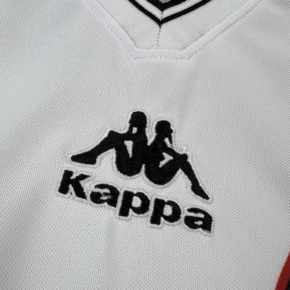 Retro football jersey chest logo: black Kappa text on white fabric