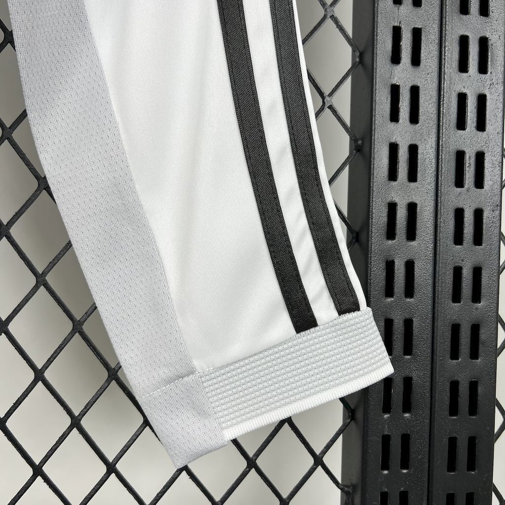 White long-sleeve jersey sleeve with ribbed cuff and black side stripe