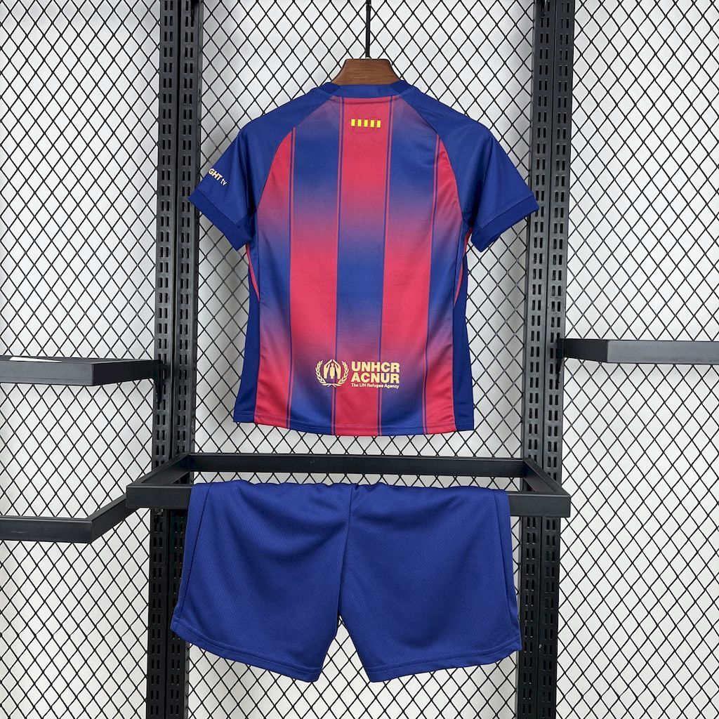 Kids FC Barcelona home kit: blue jersey back and matching blue shorts on display