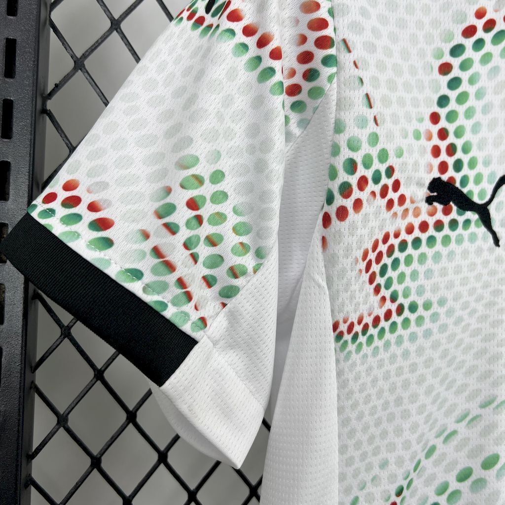 White kids jersey sleeve with black cuff and multicolor dot swirl pattern