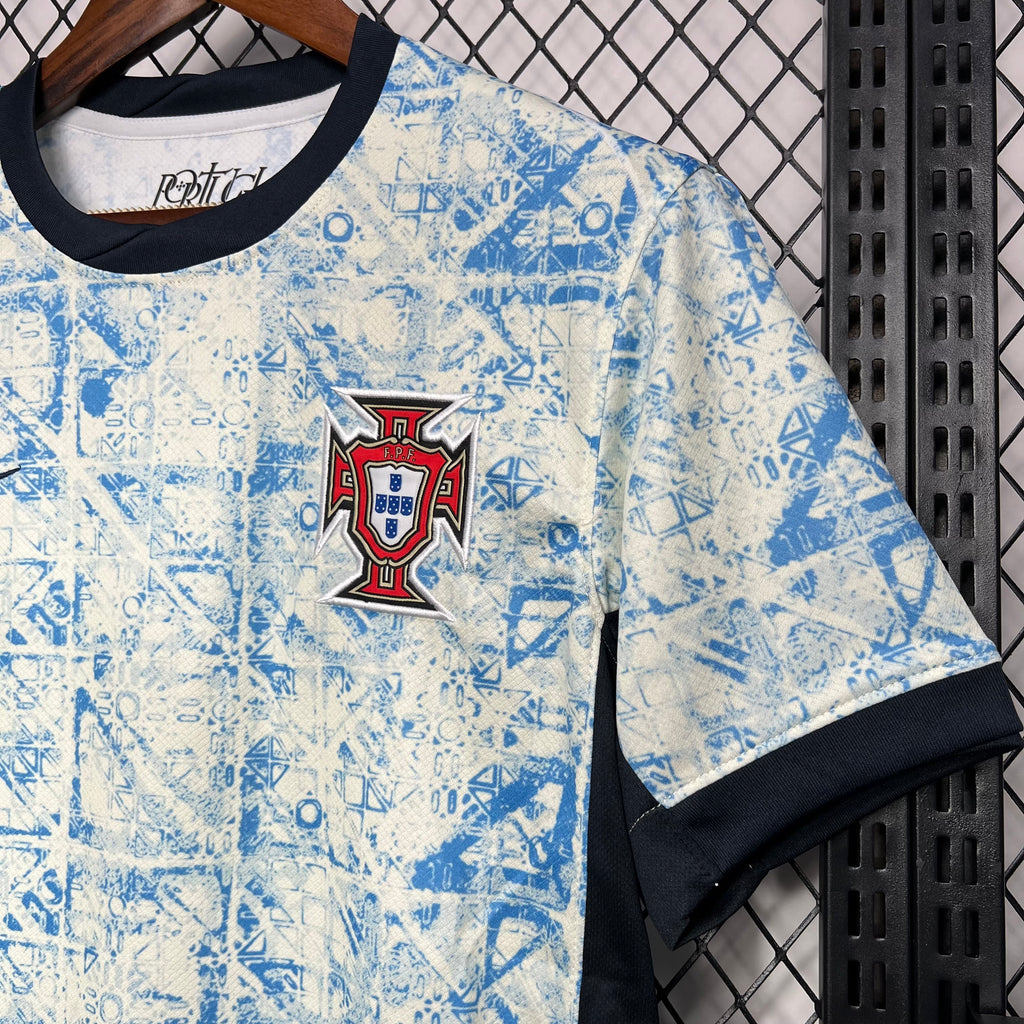 Light blue fan jersey with Portugal crest patch and black sleeve cuff trim