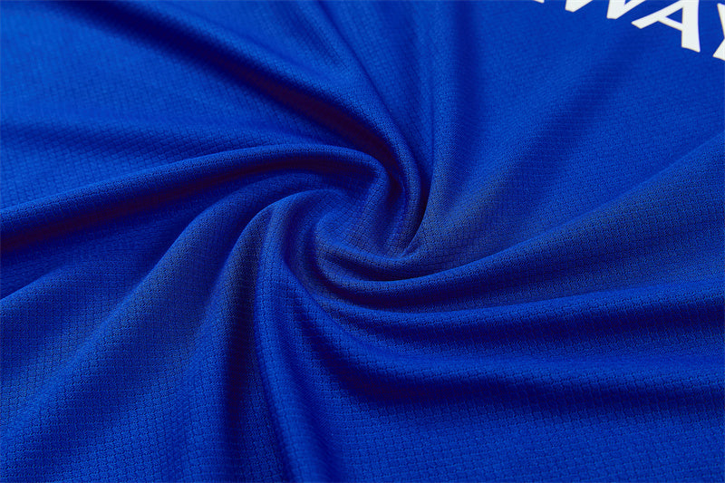 Blue performance jersey fabric close-up with breathable knit texture