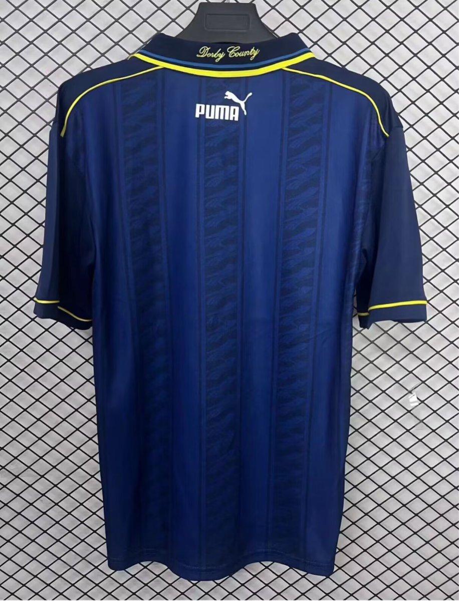 Blue retro away jersey back with yellow collar trim and Puma logo
