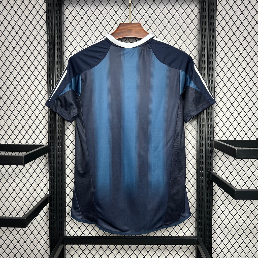 Navy and light-blue away soccer jersey, raglan sleeves with adidas white stripes