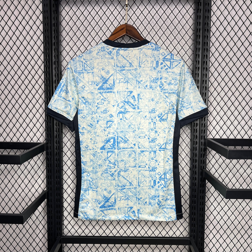 Light blue fan jersey with black collar trim and allover geometric print
