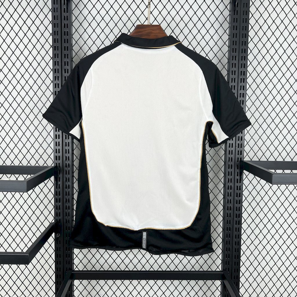 White and black retro away football jersey back view with short raglan sleeves