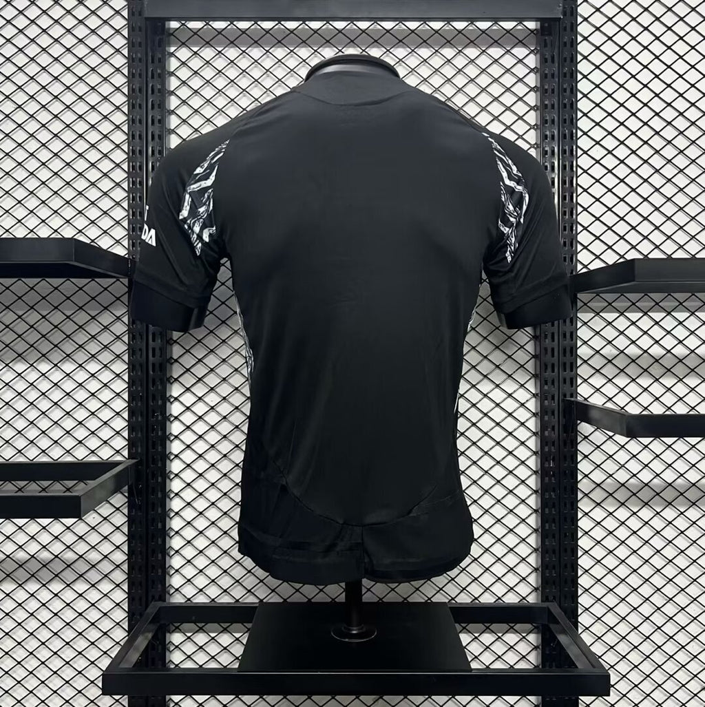 Arsenal away football jersey back, black with green-red collar accents