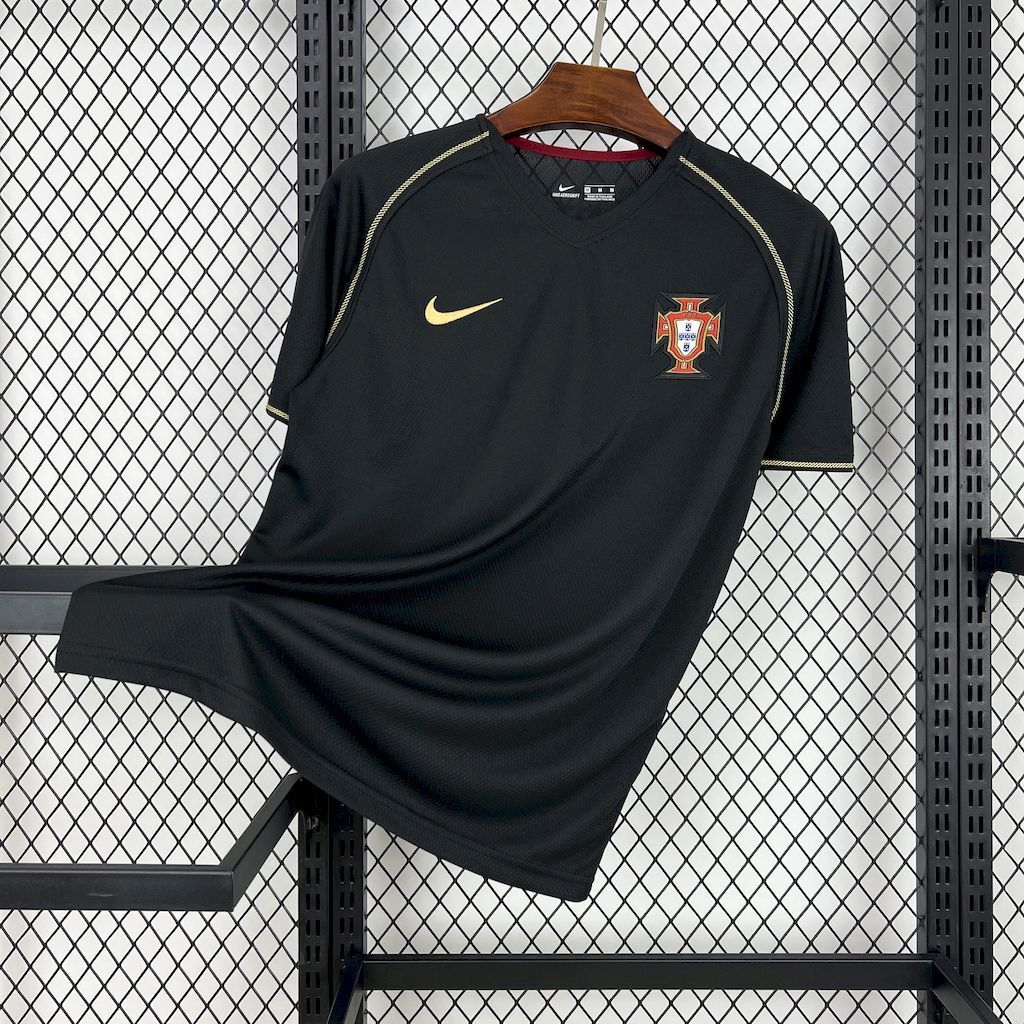 Black soccer jersey with gold Nike swoosh and Portugal crest on chest
