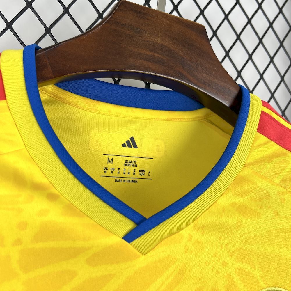 Yellow soccer jersey collar with blue trim, inner size label, Adidas logo.