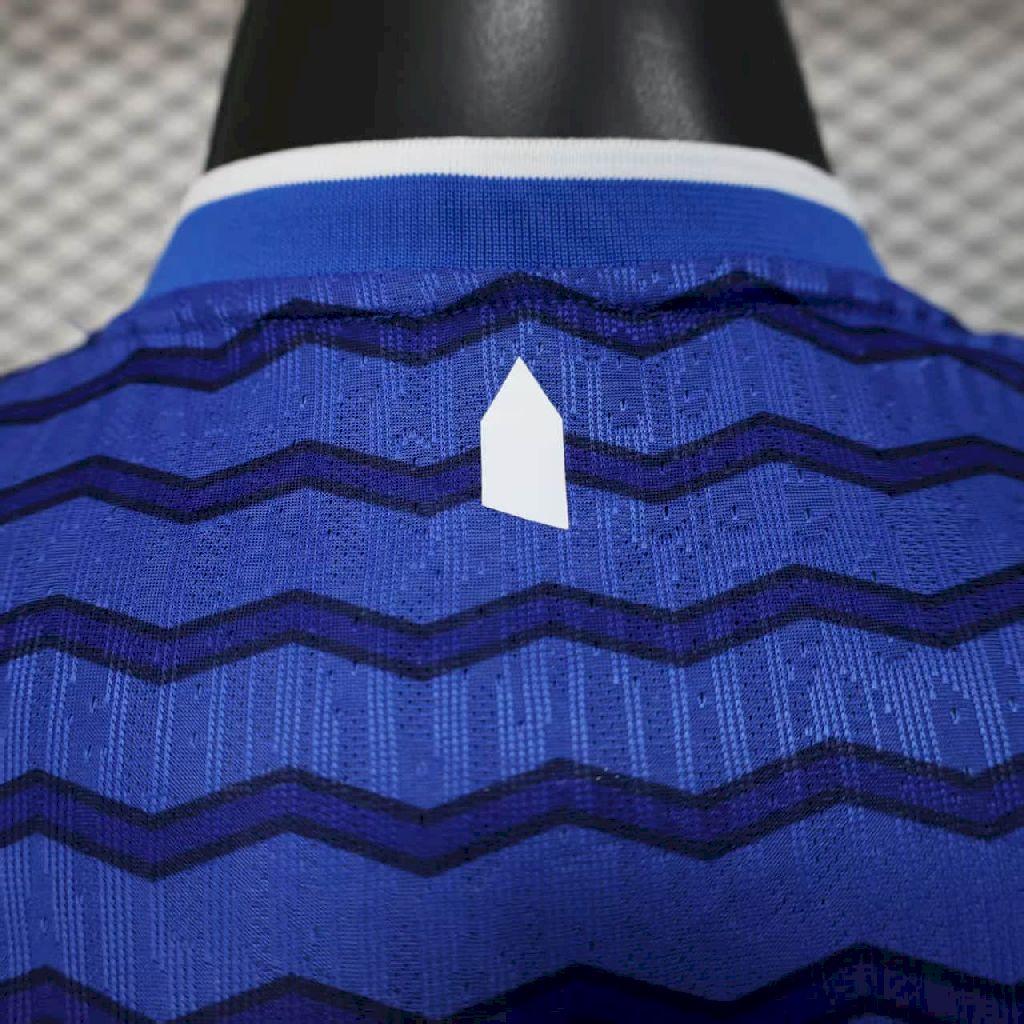 Blue zigzag striped football jersey with white neck trim and white number patch