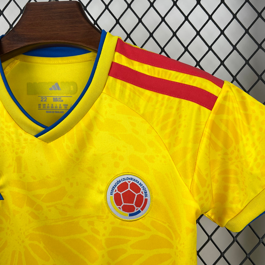 Yellow Colombia jersey front with crest and blue Adidas V-stripe logo