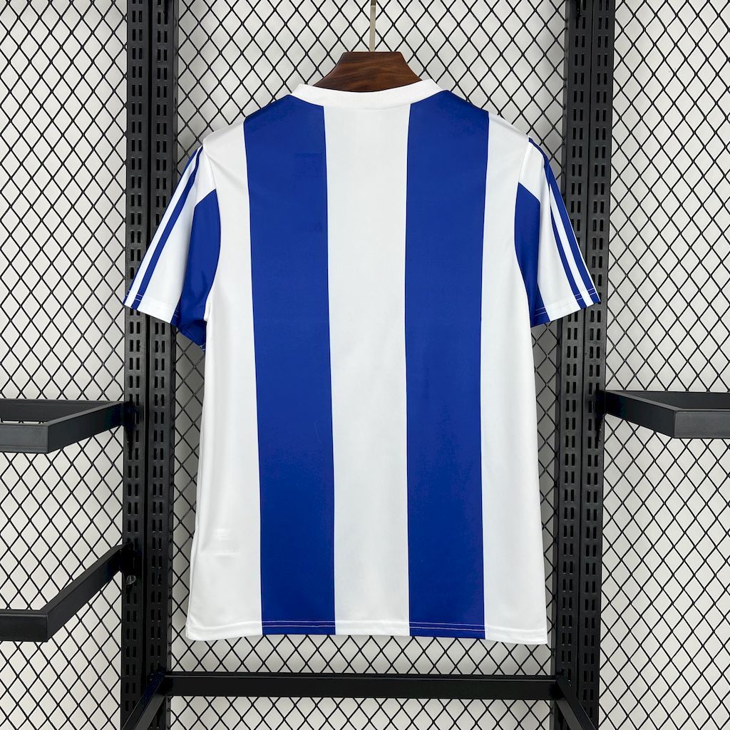 Back view of blue and white striped retro home football jersey