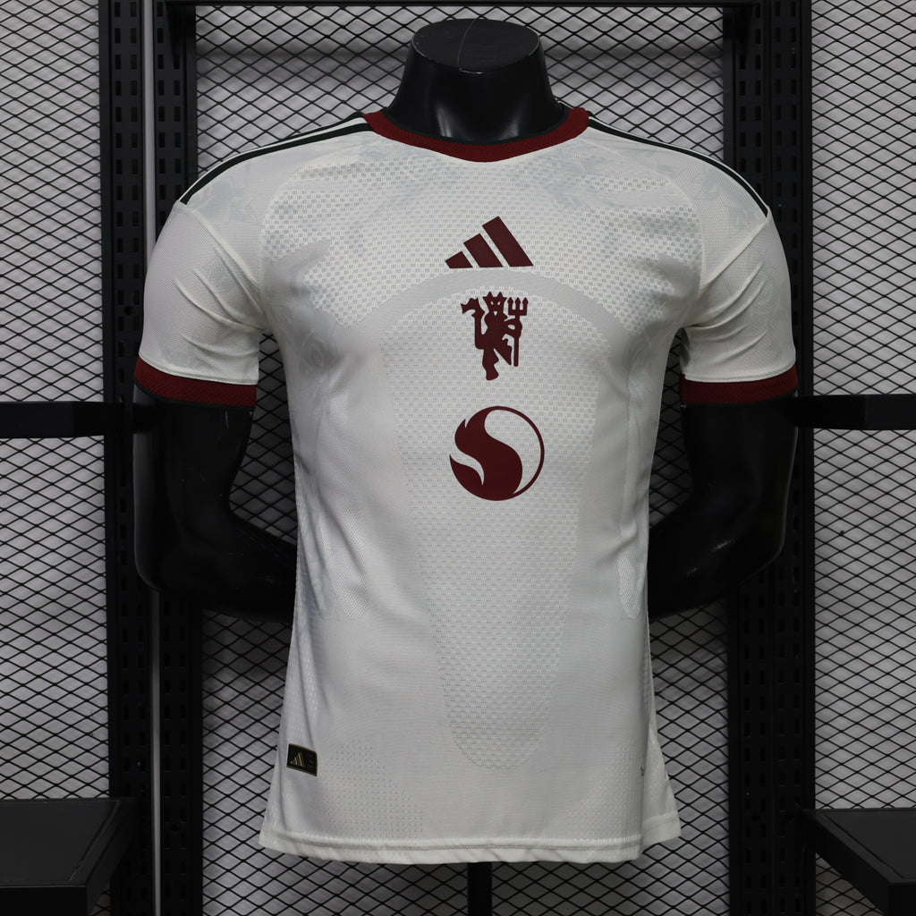 White Manchester United third player football shirt with maroon adidas and crest