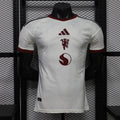 White Manchester United third player football shirt with maroon adidas and crest