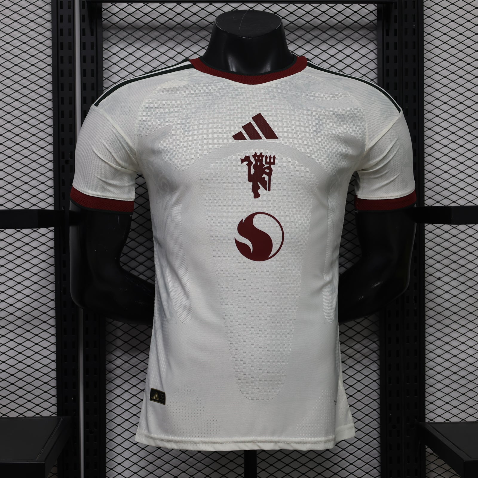 White Manchester United third player football shirt with maroon adidas and crest
