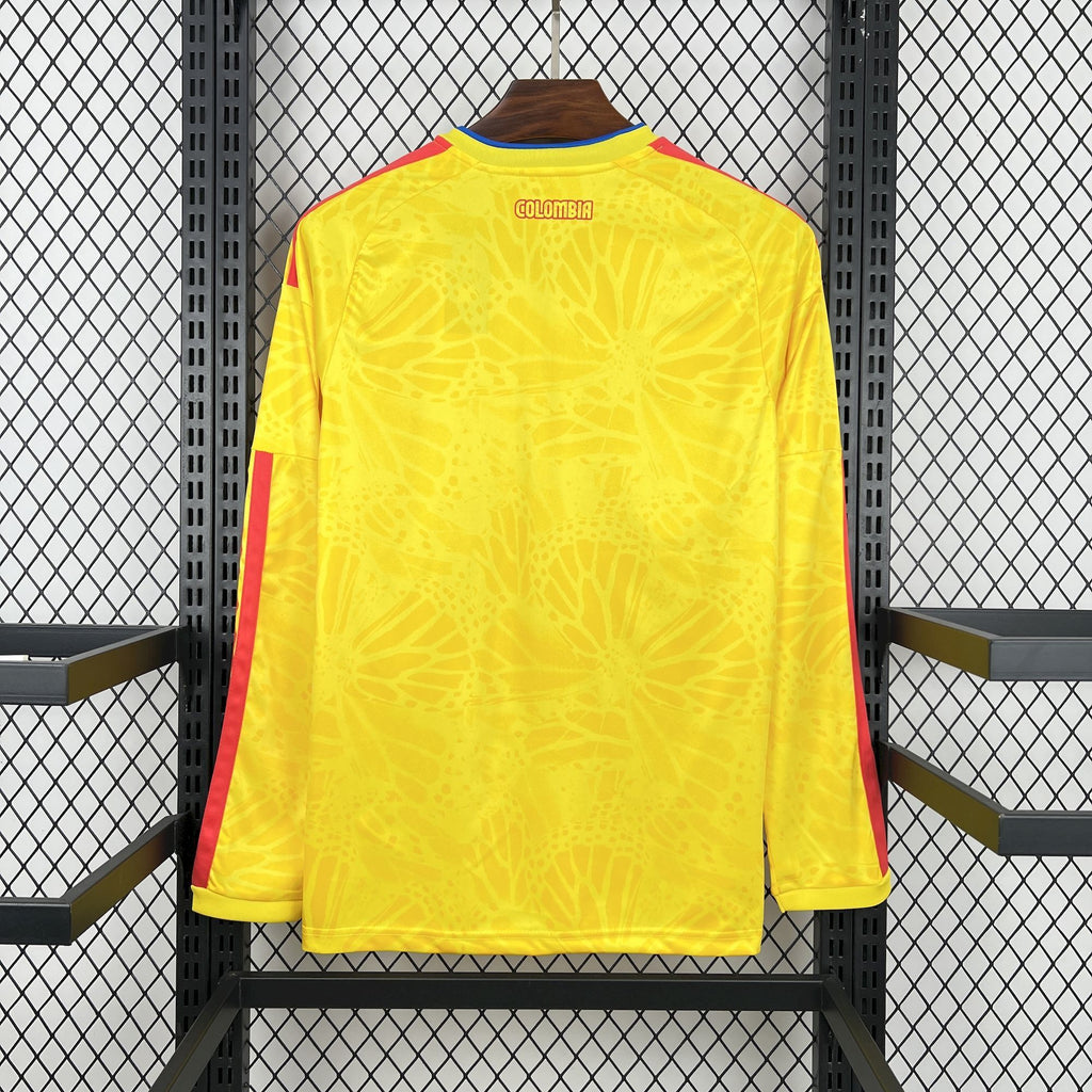 Yellow Colombia home soccer jersey back view with blue collar trim and red side stripes.