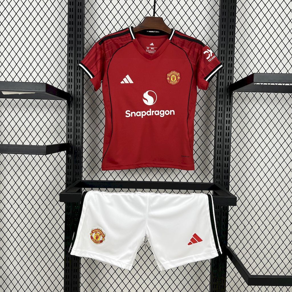 Kids Manchester United home football shirt and white shorts set, red with black trim
