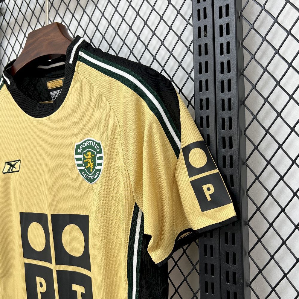 Yellow retro football jersey sleeve with club crest and black 'P' panel, green stripes